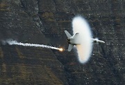 A Swiss Air Force F18 fighter jet releases flares during a flight ...