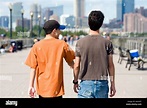 Two teenage boys spend time together walking and talking with New York ...