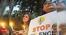 Activists hold candlelight vigil | Delhi News - Times of India