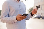 Cropped Image of Young Casual Man Using Mobile Phone Stock Image ...