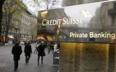 File photo of a Swiss bank Credit Suisse sign in front of a branch ...