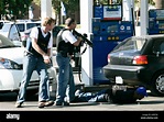 FBI agents arrest a group of men at the Mobil gas station on Madison ...