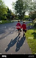 two young boys walk to school Stock Photo - Alamy