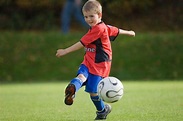 Little boy playing football | Playing football, Football kids, Soccer