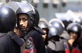 Egyptian riot police take their places as they move into Tahrir square ...