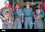 Afghan National Police officers stands guard at the door of the ANP ...