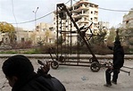 A Free Syrian Army catapult fires homemade grenades at Syrian Army ...
