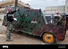 Free Syrian Army fighters inspect a homemade tank. It was designed for ...