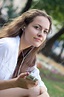 Young woman listens to music in ear-phones — Stock Photo © vitmihailov ...