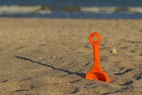 Digged Into The Sand Shovel On Beach Stock Photo - Download Image Now ...