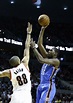 Oklahoma City Thunder forward Kevin Durant, right, shoots over Portland ...