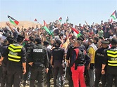 Jordanian police disperse protesters near border with West Bank | Reuters