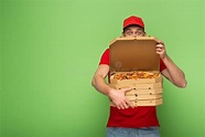 Delivery Man in Red Uniform Hiding Behind Pizza Boxes on Green Stock ...
