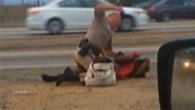 Video shows cop punching woman on L.A. freeway