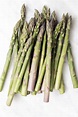 A bunch of fresh asparagus on white background - Free Stock Image