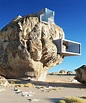 Modern Rock House Built Into the Side of an Enormous Boulder