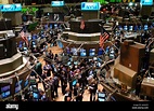 Stockbrokers busy on the trading floor of the New York Stock Exchange ...