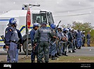 RUSTENBURG, SOUTH AFRICA: Police monitor striking Anglo Platinum mine ...