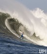 Photo: A surfer rides a giant wave during the Mavericks contest in Half ...