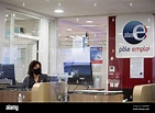 Staff of pole emploi next to logo of Pole Emploi as President of the ...