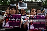 Women's rights activists hold placards during a candlelighting vigil ...