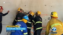 Woman rescued after getting trapped between two buildings in southern ...