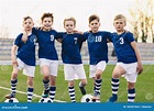 Young Boys in Soccer Team. Happy Junior Sports Group of Kids Stock ...
