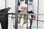 Prime Minister Al-Baghdadi Ali al-Mahmoudi sits in a cage.… | Flickr