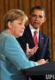 Photo: President Obama and German Chancellor Angela Merkel hold a joint ...