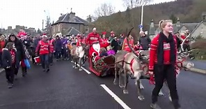 Dunkeld Santa Day 2018 with Reindeer pulling Santa from Birnam into Dunkeld, Scotland