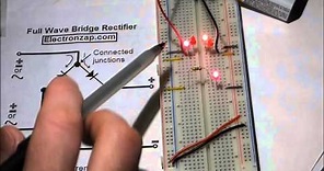 Electronics circuit. Full wave bridge rectifier. LEDs and 1N4001 diodes. Rectifier component shown.