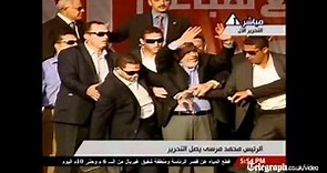 Egypt s President Mohamed Morsi takes a symbolic oath in Tahrir Square