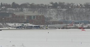 Plane slides off runway while taxiing passengers to terminal in Portland