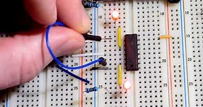 How to wire a flip flop circuit using 2 NAND gates in SN74HC00N integrated circuit IC