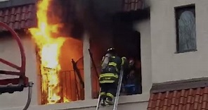 Firefighters Rescue Man from Burning Apartment