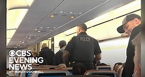 Man arrested after threatening passenger mid flight